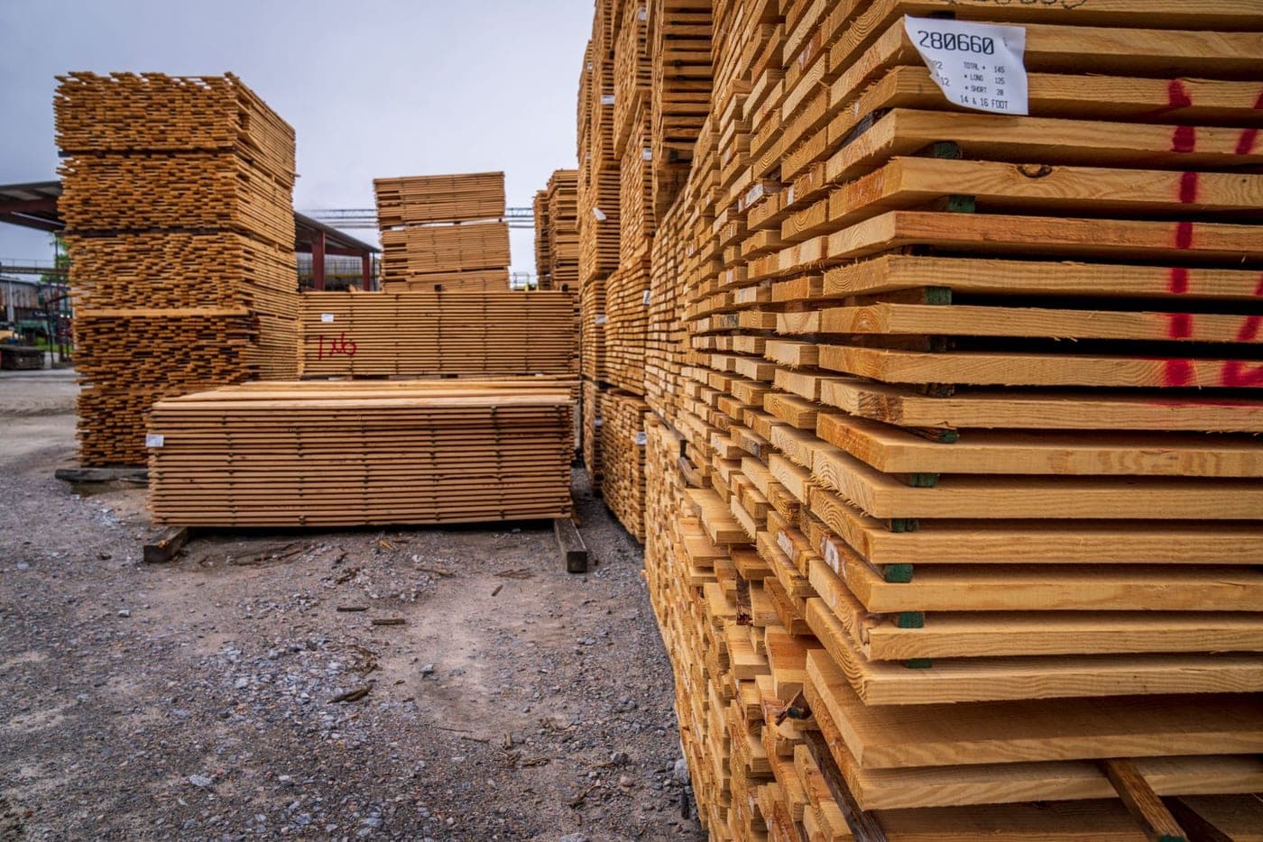 Stacks of dimensional lumber in a lumber yard